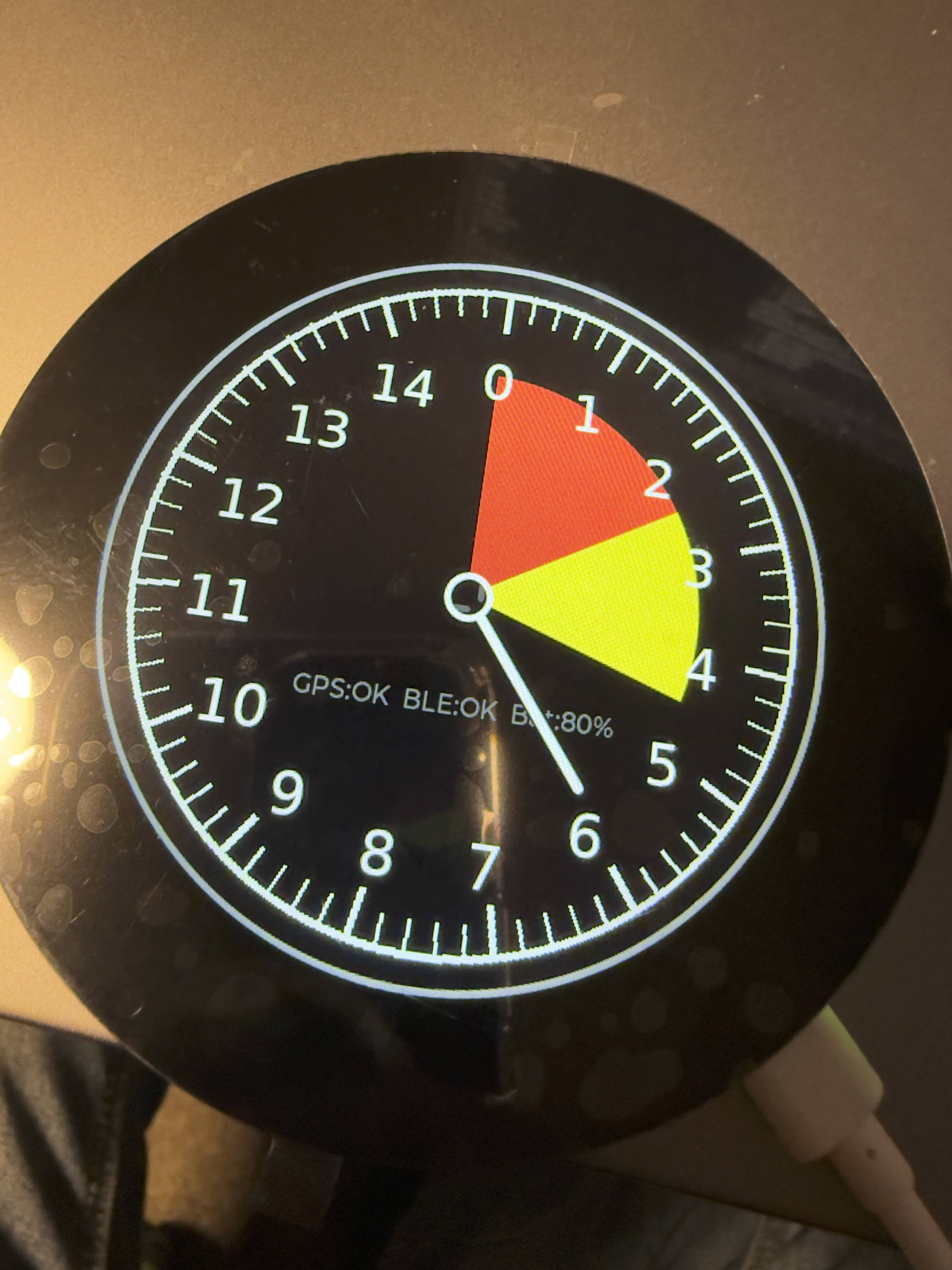 Early Apex Infinity device prototype with a round instrument display